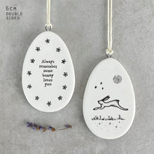 Load image into Gallery viewer, Porcelain Flat Hanging Ceramic Egg with message 'Always remember some bunny loves you'