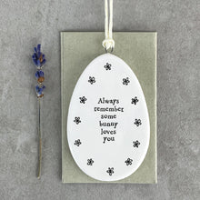 Load image into Gallery viewer, Porcelain Flat Hanging Ceramic Egg with message 'Always remember some bunny loves you'